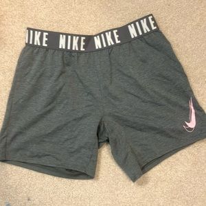 Nike gray running shorts with pink Nike swish